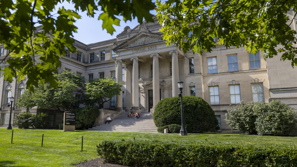 An image of Schaeffer Hall in the spring with green leaves